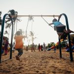 children playing on a swing - Playground Aesthetics